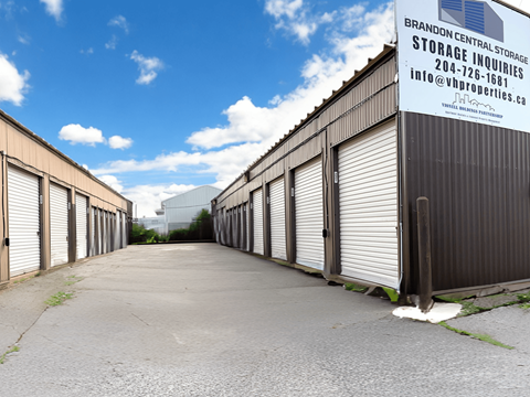 a large industrial building with closed doors and a sign on the side